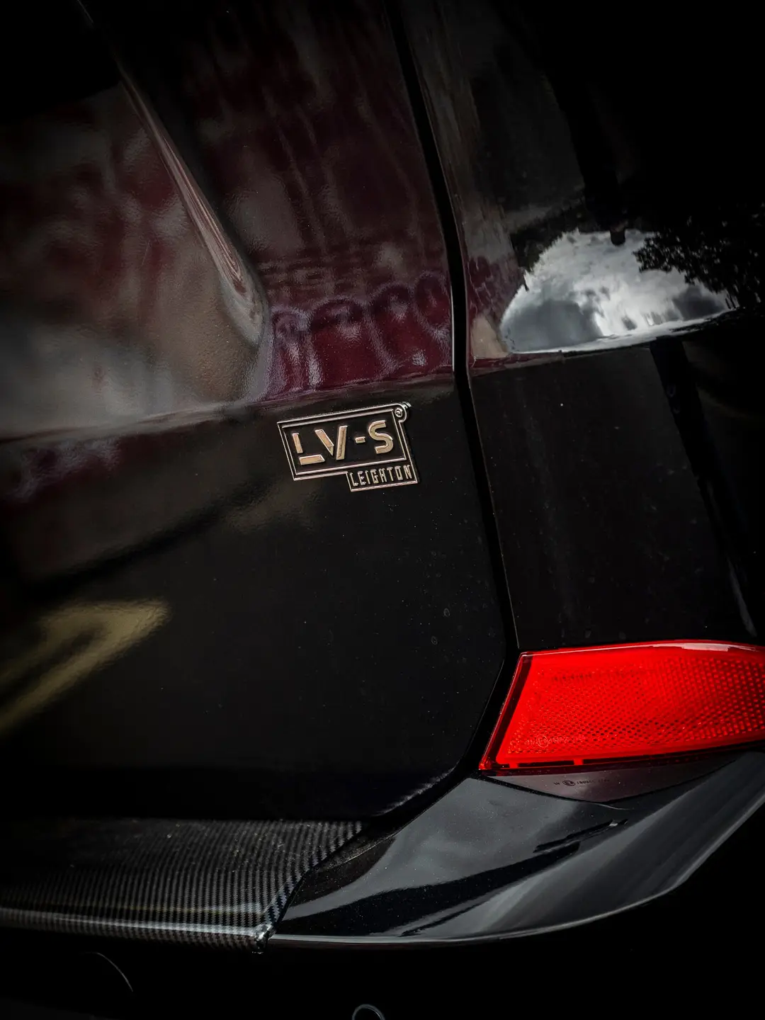 LV-S badge on the rear of the black VW Transporter T7 kombi