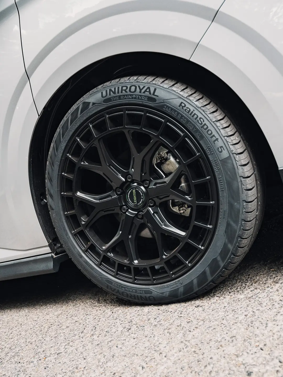 Black alloy wheel on the grey VW Transporter T7 panel van