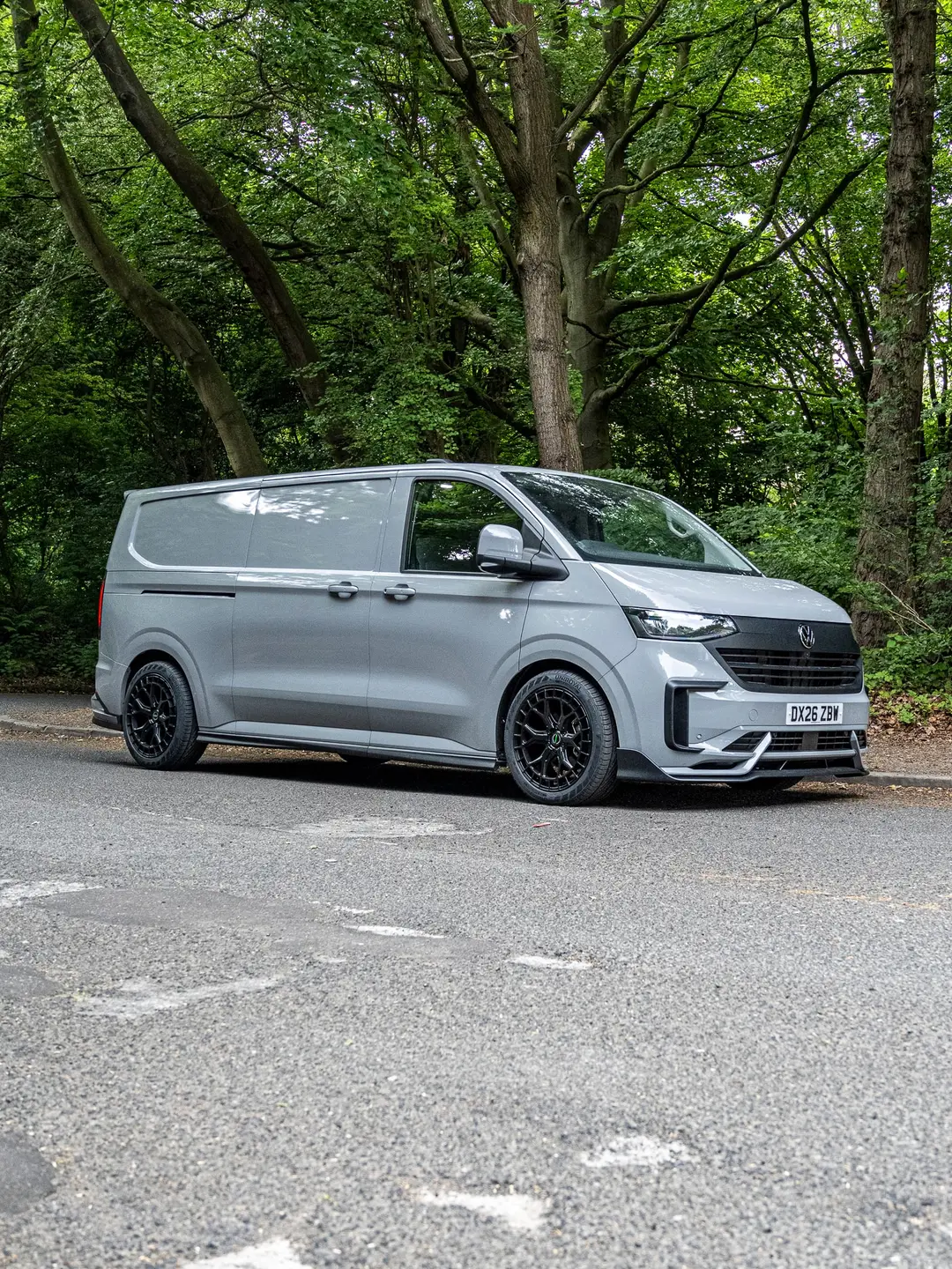 Grey VW Transporter T7 panel van from the side